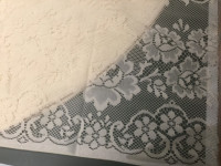 Cream colored lace tablecloth