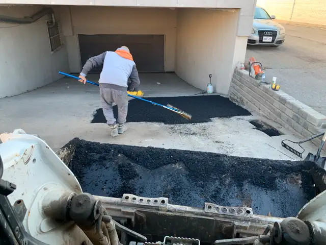 Parking lot pothole repair63235338187905123