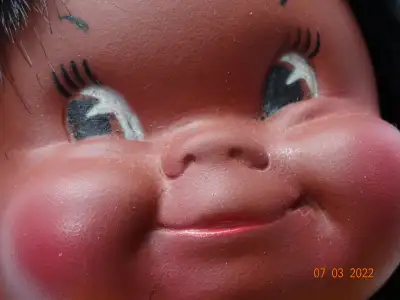 Native like doll made by Regal Toy, Canada, Clean beanbag body with vinyl head and hands. Design on...