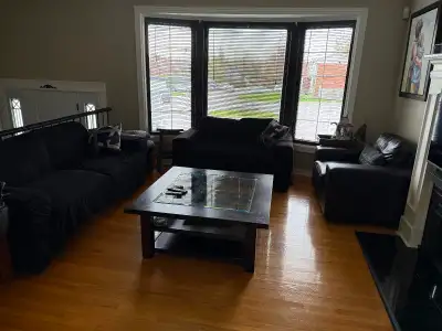 Brown/ black 3 piece living room set. 3 person couch, love seat and single chair. Bonded leather, le...