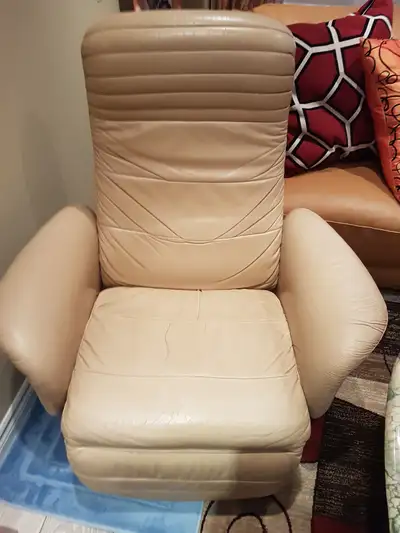 Swivel Danish leather chair, reclines and swivel, used but no defects.