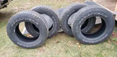 4 265/65r18 used Goodyear Wrangler tires and 1 275/65r18. One tire has tread wear on the inside wall...
