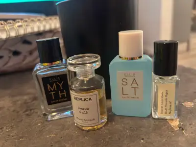 Four small bottles of popular, trending, luxury perfumes, View more