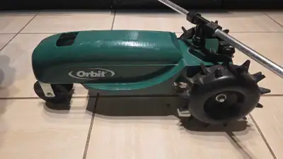 Self propelled Orbit sprinkler. Just hook up your garden hose, set the path, and it drives itself ac...