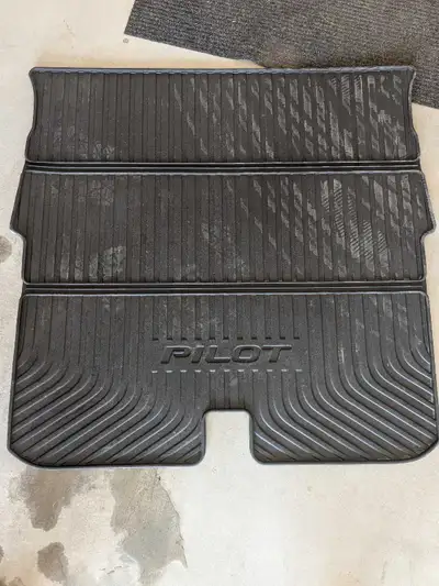 Durable black rubber Honda Pilot cargo liner. This all-weather mat has a textured, non-slip surface...