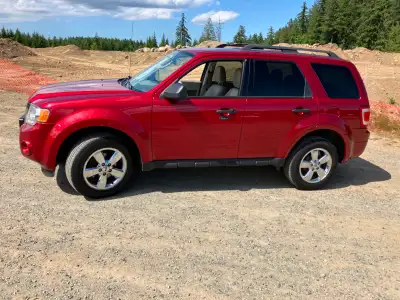 Red Escape XLT with beige leather seats. 4 cylinder, 2.5 L. FWD. Fog lights. Sunroof. Great conditio...