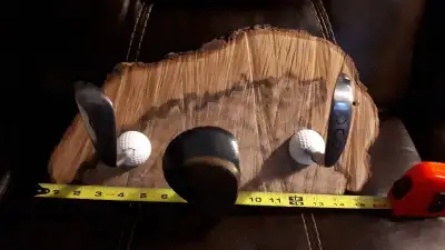 Golf Head Coat Rack on Live edge piece of wood. AWESOME!, View more
