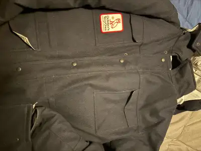 Stay warm and stylish this winter with this October's Very Own (OVO) Canada Goose Wool Parka in size...