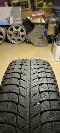 One 185 60 15 Michelin x-ice tire.