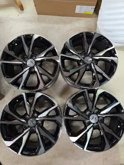 Brand new factory aluminum rims with center caps for sale. These wheels are factory-standard for var...