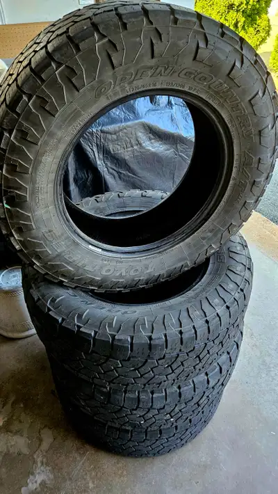 Toyo open country AT II 275/65/18. Between 6/32 & 7/32 left on them. Evenly rotated. Open to offers.