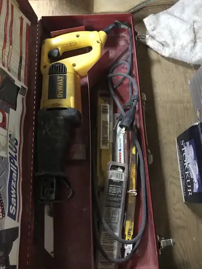 Reciprocating saw, dewalt, metal case, assortment of saw blades, View more