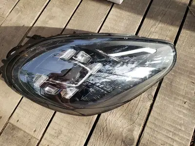 2015-2018 Porsche Cayenne LED Headlight Passenger side Headlight assembly Small bits of broken plast...