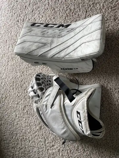 These were worn in U15 by my son for 2 seasons. Some wear on the fingers, and upgraded webbing to ma...
