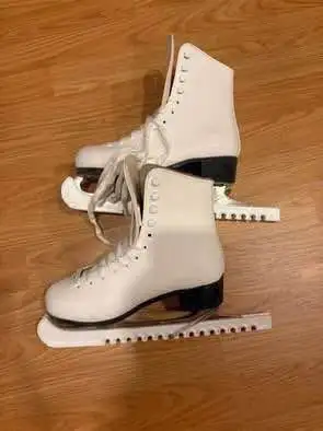 Ice skates with skate guards (Size 7)(In good condition), View more