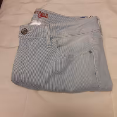 Size 10-12 Brand New Light Blue Pinstripe Denim Capri. Inseam 24". Classic Fit. Mid-Rise. Tummy Cont...