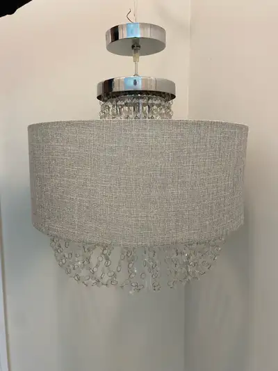 Add a touch of elegance to your home with this Bouclair grey fabric shade chandelier with crystal pe...