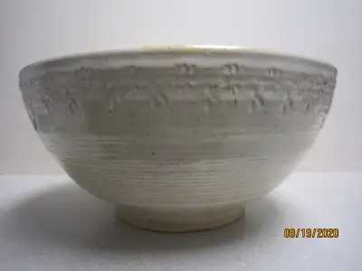 This is a large handmade pottery bowl signed by well known Canadian Artist Astrid Kruse. Soft beige...