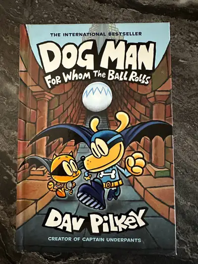 Dive into the tail-wagging world of Dog Man: For Whom the Ball Rolls by Dav Pilkey! This book is in...
