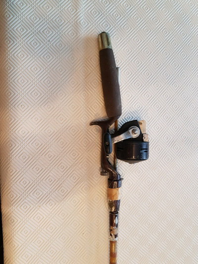 Vintage fishing rod and reel, View more