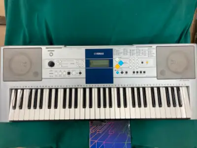 YAMAHA PSR-E323 Keyboard for sale. Works fine. Comes with a/c adapter, and stand. Fun to play. Great...