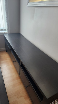 IKEA TV Bench - dark brown in color with 3 drawers and shelves.