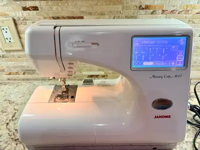Janome Memory Craft 9000 sewing machine, a computerized model known for its versatility and precisio...
