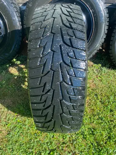 Set of Winter Tires on Rims, 205/65/15. Rims 6J x 15 - like new - $450. Set of Wheel Covers, Silver...