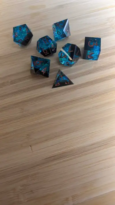 Really nice, high quality d&d dice. Resin cast with some sparkly paper inside. Feel like casino dice...