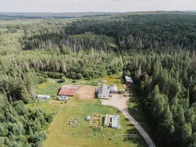 Spacious, partially furnished home with wood stove + baseboard heat, 1 bath, laundry area prepped fo...