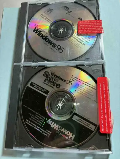 Two genuine used Microsoft CDs Windows 95 Starts Here (updated Edition) How & Why Microsoft Windows...