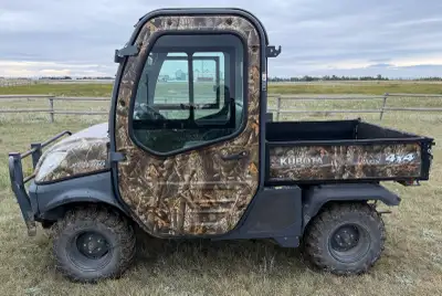 Enclosed side by side is in fair working condition. 2875 hours. Bought a new tractor and no longer r...