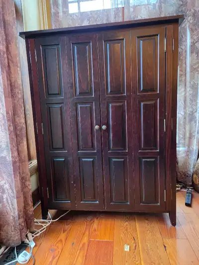 42" wide x 56" high x 24" deep cabinet that could used as a storage cabinet, game cabinet, TV/Entert...