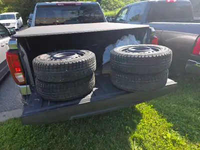 I have a set of snow tires on 4 bolt steel rims 185 65 r15 for sale