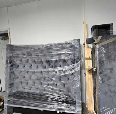 Add a touch of elegance to your bedroom with this stylish grey upholstered king-size headboard. The...