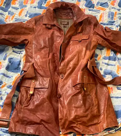 Brand name: Danier Long leather women jacket in small size. In a brand new condition. Has been wore...