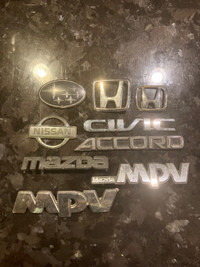 Subaru, Honda and Mazda car emblems
