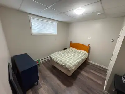 This spacious and well-lit 2 bedroom basement suite features a modern open-concept living area with...
