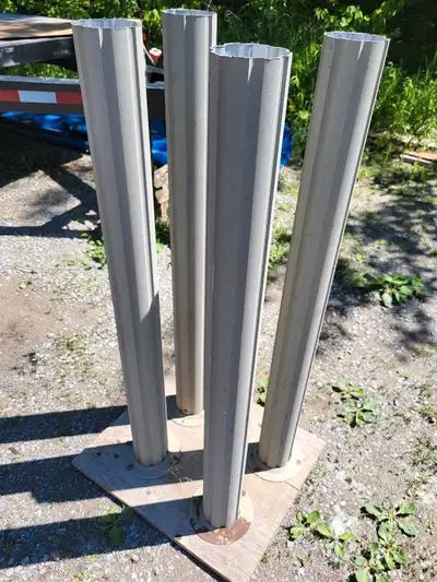 4 Aluminum posts / columns approx. 48.75" height x 4.5" . Could use to mount bird feeder or other us...
