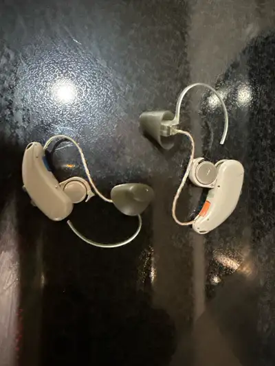 I'm selling a pair of used hearing aids. These devices have been previously owned, but they are comp...
