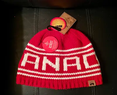 Stay warm and stylish with this brand new Wind River Heritage red and white beanie, perfect for brav...