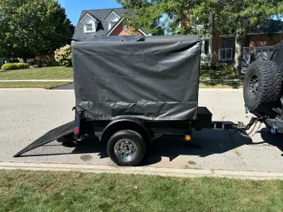 Utility trailer with ramp,size is 4x 6 with 13 inch wheels, waterproof canvas cover, spare tire, lev...