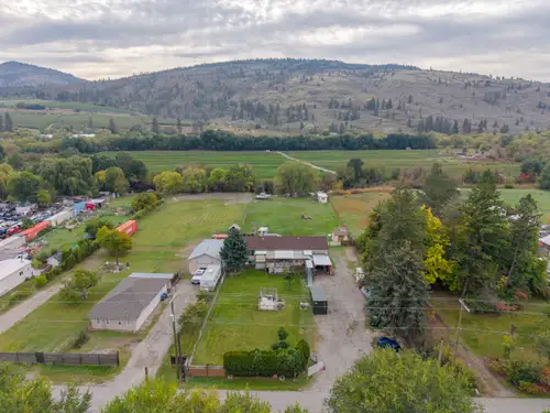 Set on a flat, fenced 0.912-acre property backing onto the peaceful oxbow, this Oliver property offe...