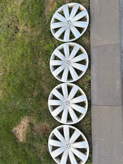 Set four hubcaps, for 15” Steel wheels on a Volkswagen. One cap has broken tabs So three of them are...