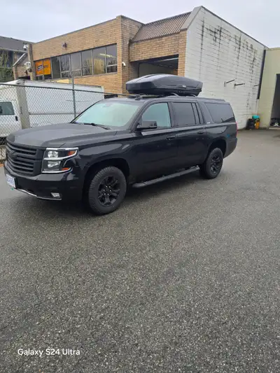 Beautiful Chevrolet Suburban Z71 4x4 black on black SUV. This vehicle has been super well taken care...