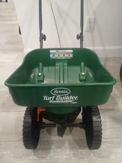 Scott's turf builder edge gaurd mini broadcast spreader. $20