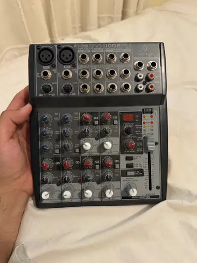 Behringer Xenyx 1002FX audio mixer.  Without cables, View more
