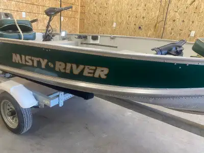 Includes fish finder, rod holders, seats, gas can, down riggers, 9.8 motor low hours, electric troll...