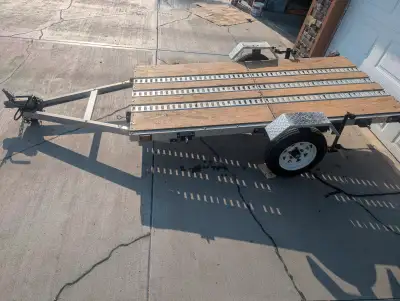 Marlon 4'x8' folding aluminum trailer. Deck is 5/8" plywood with three 8' lengths of e track to secu...