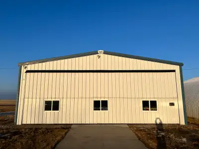 44 X 36 Unheated Hangar with 40’ Overhead door and two walk-in doors. Concrete floor and maintained...
